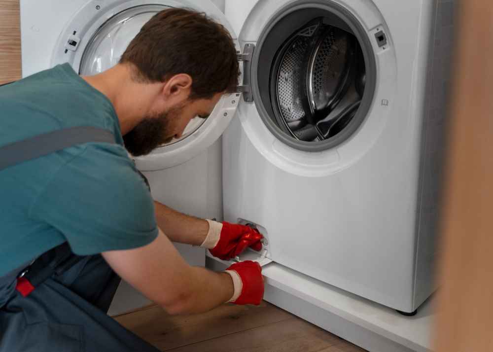 Expert Technician Repairing a Washing Machine in Abu Dhabi